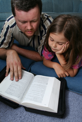 Father reading Bible